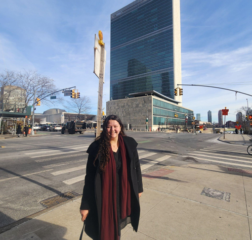 Madison Ferguson in front of the United Nations Headquarters.