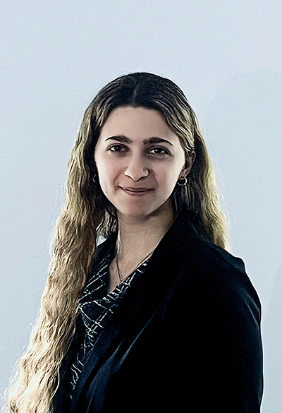 Young woman with long brown hair on blue background