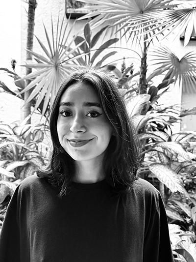 black and white picture of young woman with shoulder length black hair